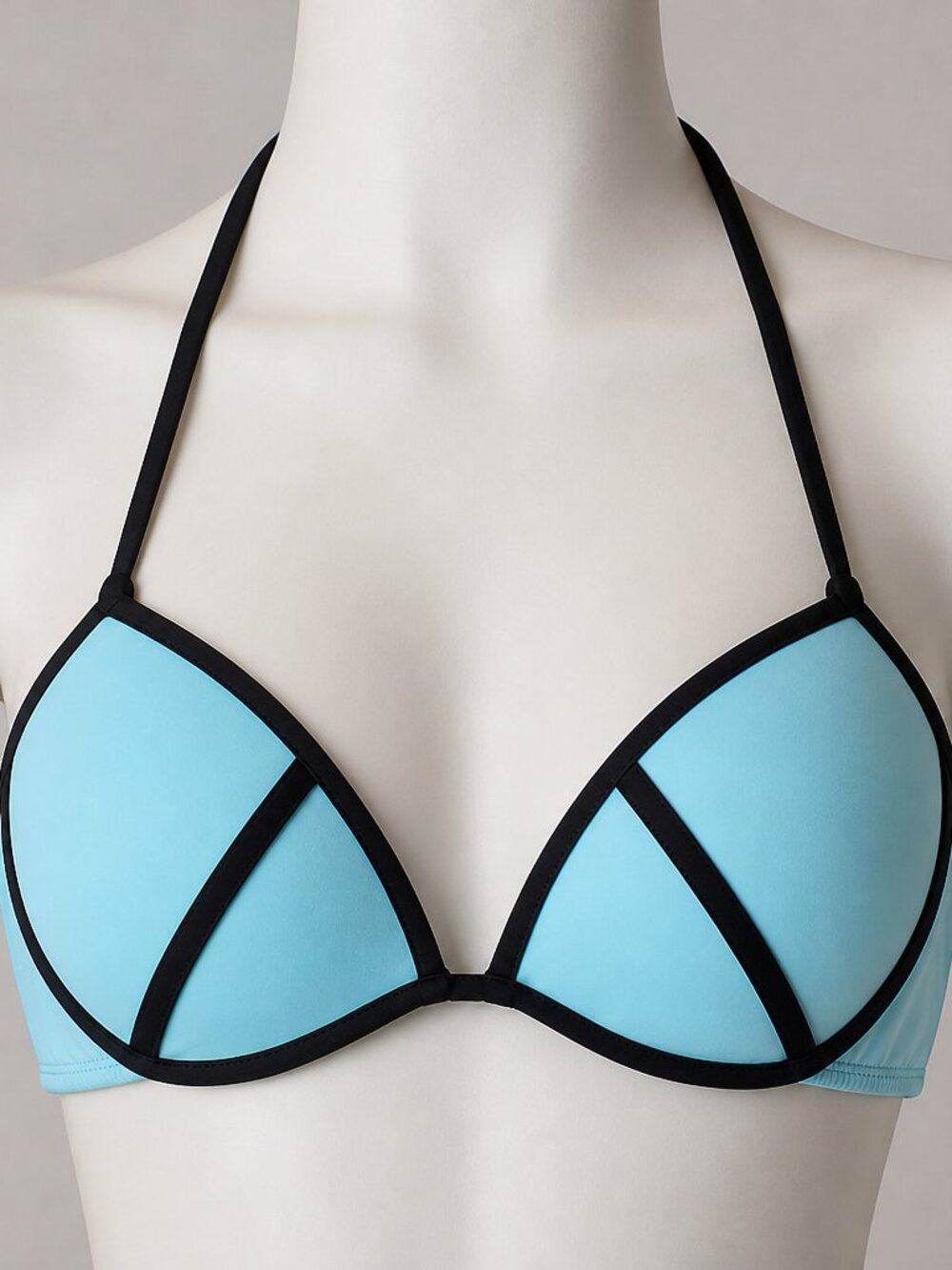 Bold outlined teal and black push-up bikini top